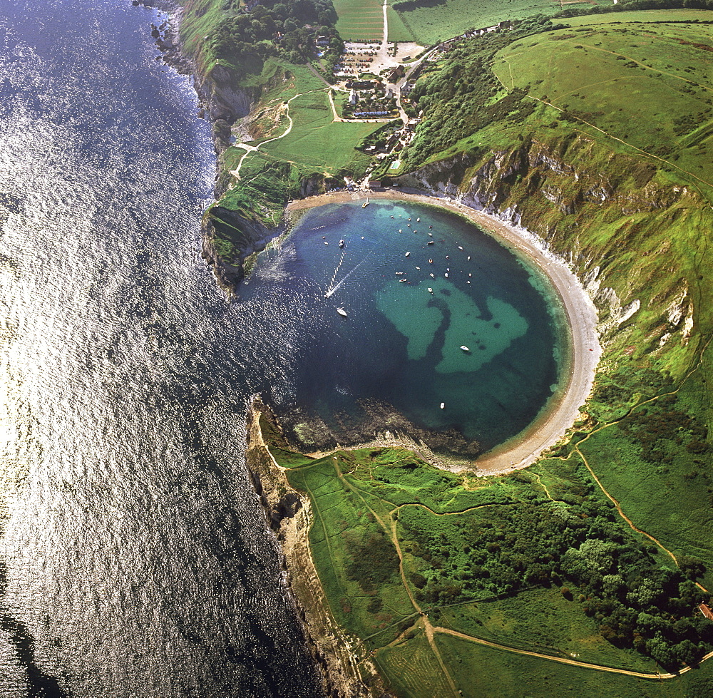 Aerial image of Lulworth Cove, a natural landform harbour, near West Lulworth, on the Jurassic Coast, UNESCO World Heritage Site, Dorset, England, United Kingdom, Europe