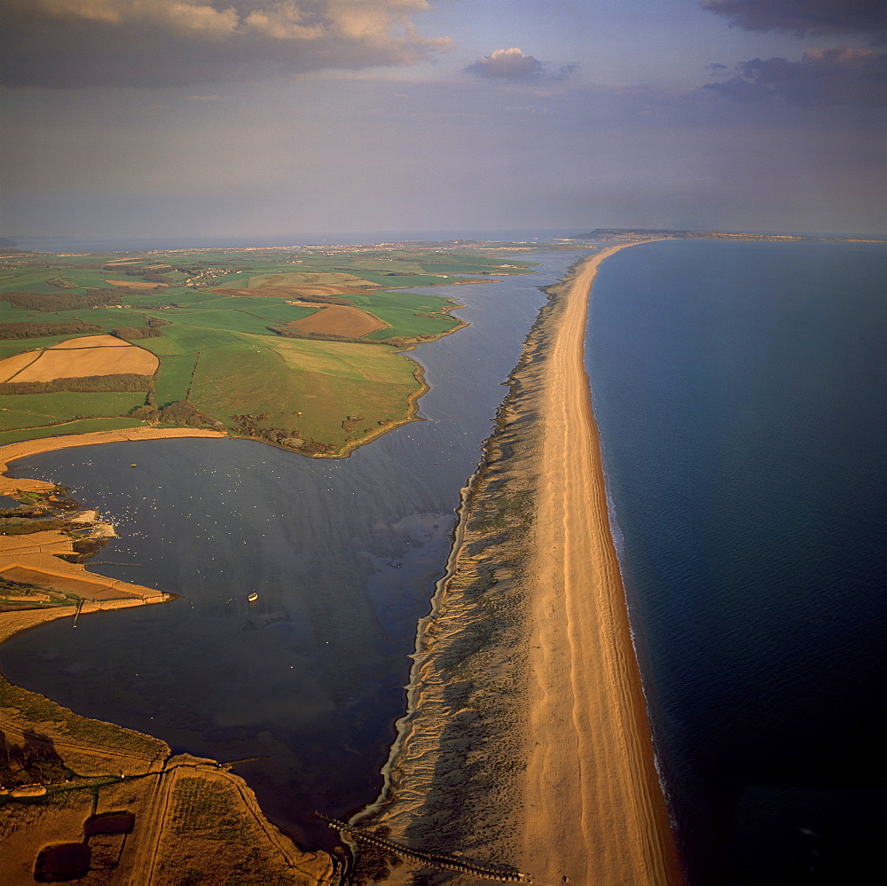 Aerial image of Chesil Beach (Chesil Bank), 29 km long shingle beach, a tombolo connecting mainland to the Isle of Portland, Jurassic Coast, UNESCO World Heritage Site, Dorset, England, United Kingdom, Europe