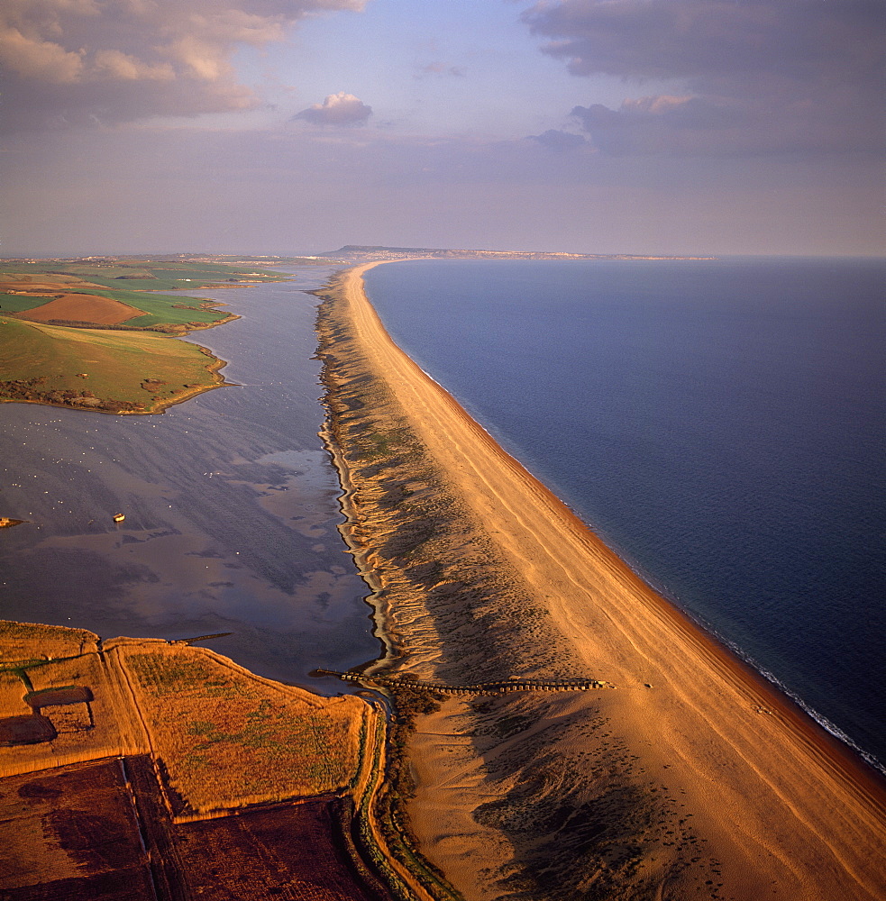 Aerial image of Chesil Beach (Chesil Bank), 29 km long shingle beach, a tombolo connecting mainland to the Isle of Portland, Jurassic Coast, UNESCO World Heritage Site, Dorset, England, United Kingdom, Europe