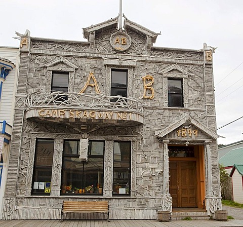 Historic wooden house, built with small logs, Broadway, centre of Skagway, Klondike Gold Rush, Alaska, USA