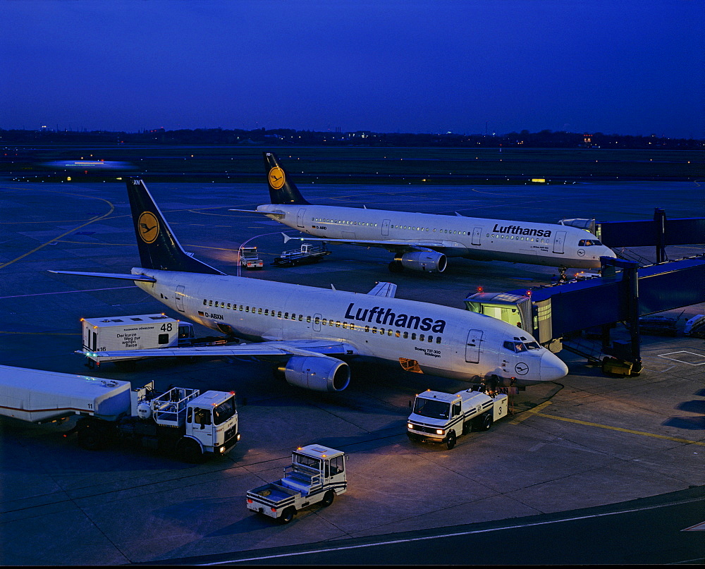 Lufthansa airplanes being loaded at night, Frankfurt International Airport, Frankfurt, Hesse, Germany, Europe