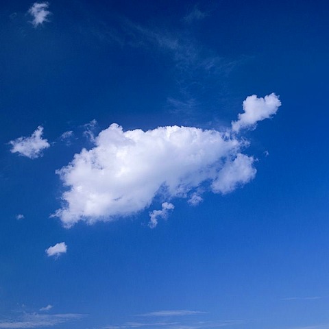 White clouds in front of a blue sky