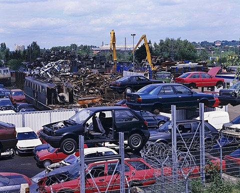 Wrecking yard, scrapyard, cars and electric locomotives, recycling, metal salvaging