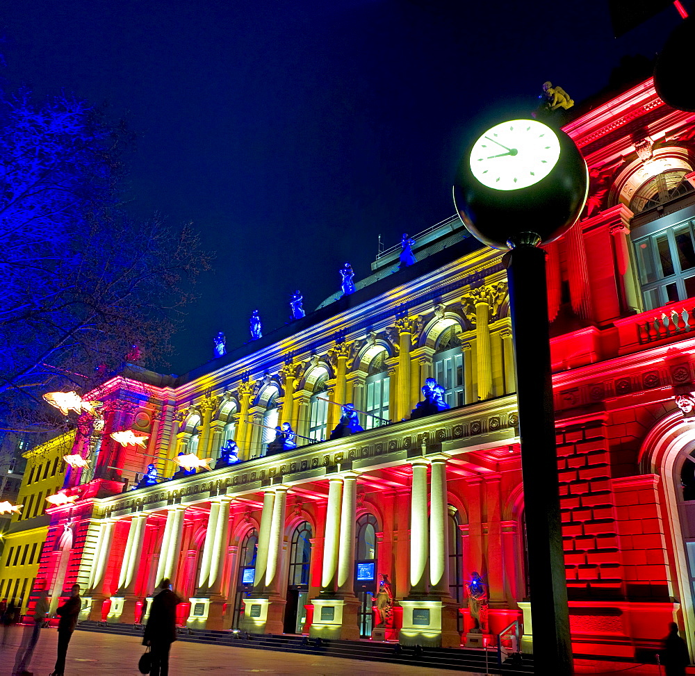 Frankfurt Stock Exchange at night, illuminated by multicoloured spotlights for the Luminale, biannual lighting festival in Frankfurt, Germany