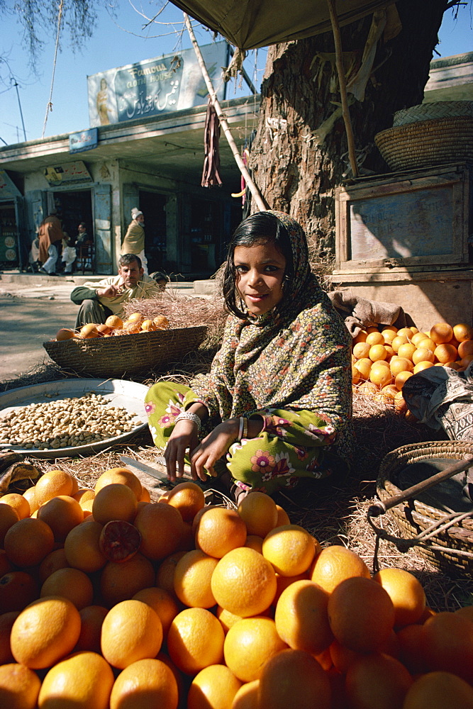 Girl selling fruit, near Peshawar, Pakistan, Asia