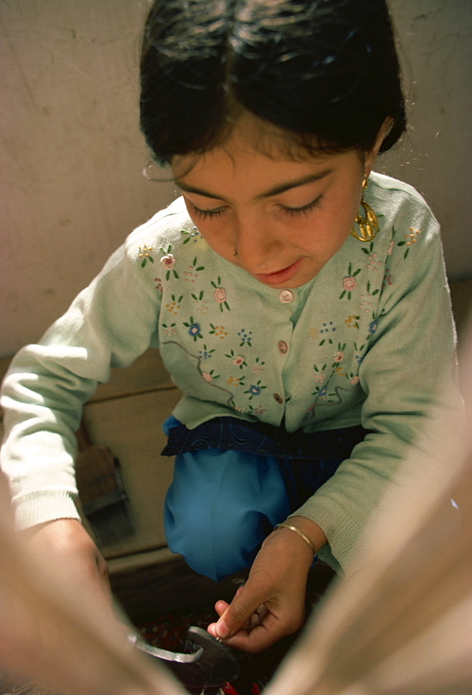 Small girl working in carpet factory in the 1970s, Quetta, Pakistan, Asia