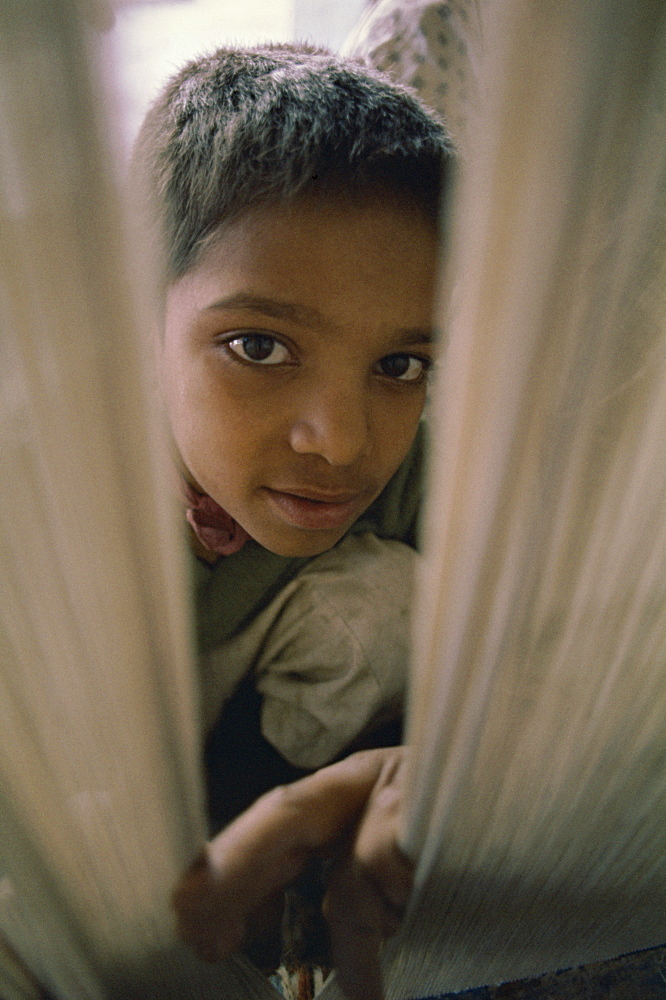 Child working in carpet factory in the 1970s, Lahore, Pakistan, Asia