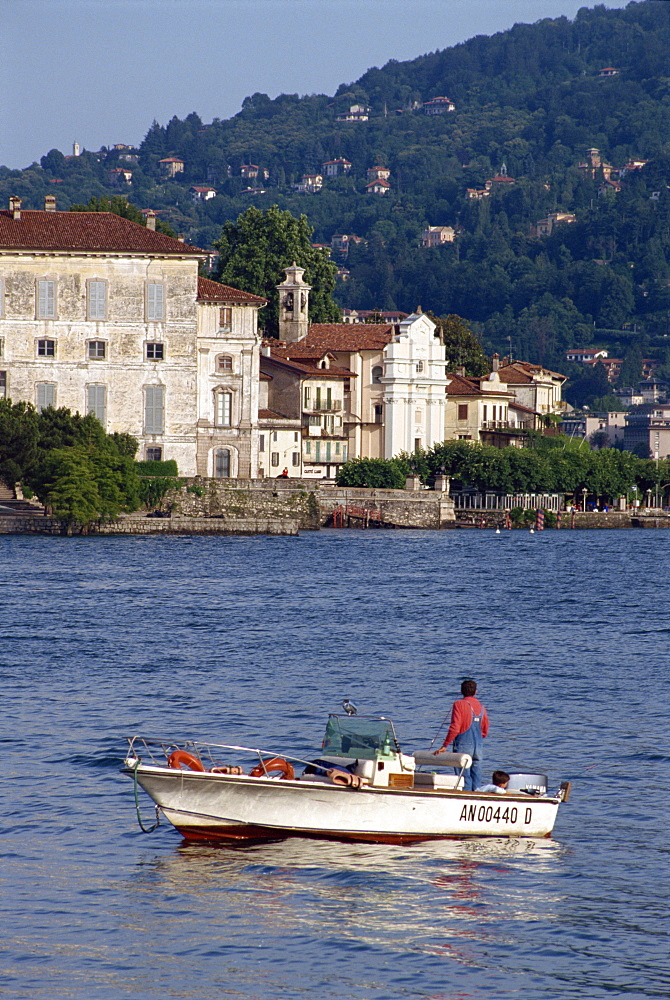 Small boat on Lake Maggiore with Isola Bella beyond, in Piemonte, Italy, Europe