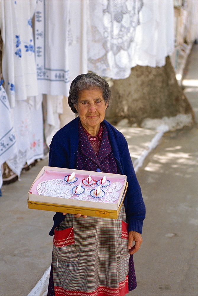 Woman selling handmade mats, Kritsa, near Agio Nikolas, Crete, Greek Islands, Greece, Europe