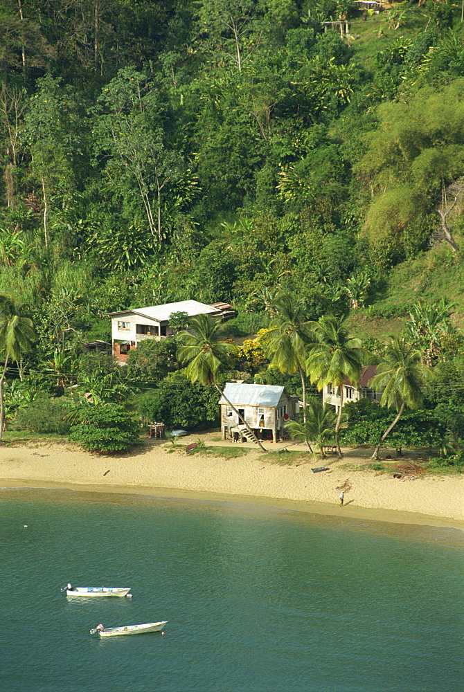 Aerial view over housing on beach in Parlatuvier Bay, Tobago, West Indies, Caribbean, Central America