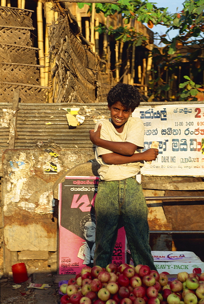 Teenage boy selling apples, Negombo, Sri Lanka, Asia