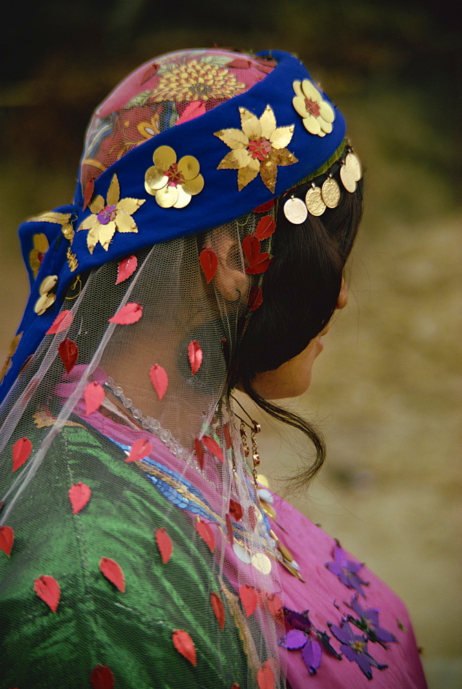 Close-up of a Boyerahmad Tribe woman, wearing traditional headscarf, Iran, Middle East