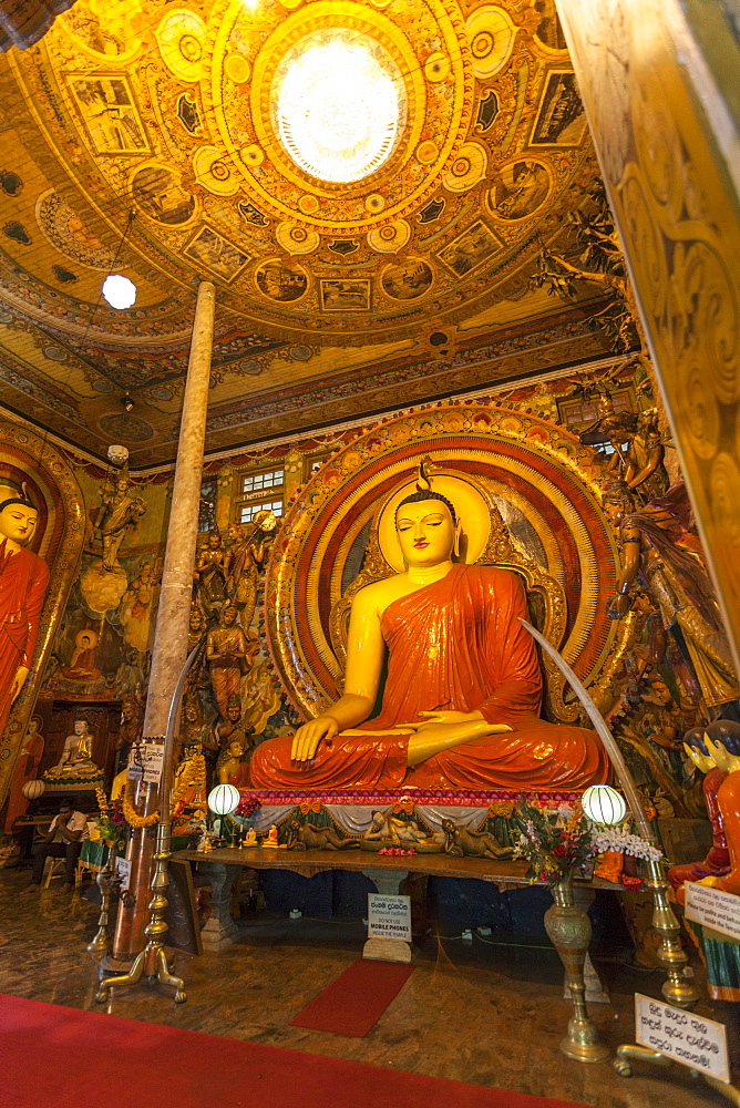 Large Buddhist statue at Gangaramaya Temple, Colombo, Sri Lanka, Asia 