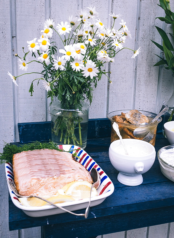 Tradtional Swedish foods, including salmon fillet with lemon and herring, Sweden, Scandinavia, Europe