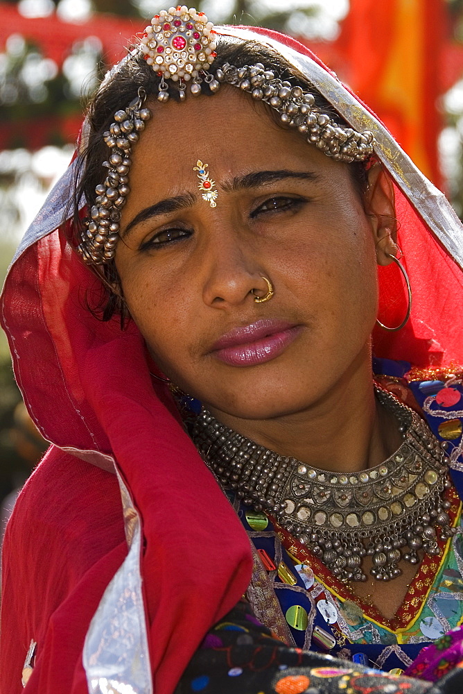 Portrait of young Rajasthani woman dressed for traditional dance, Rajasthan, India