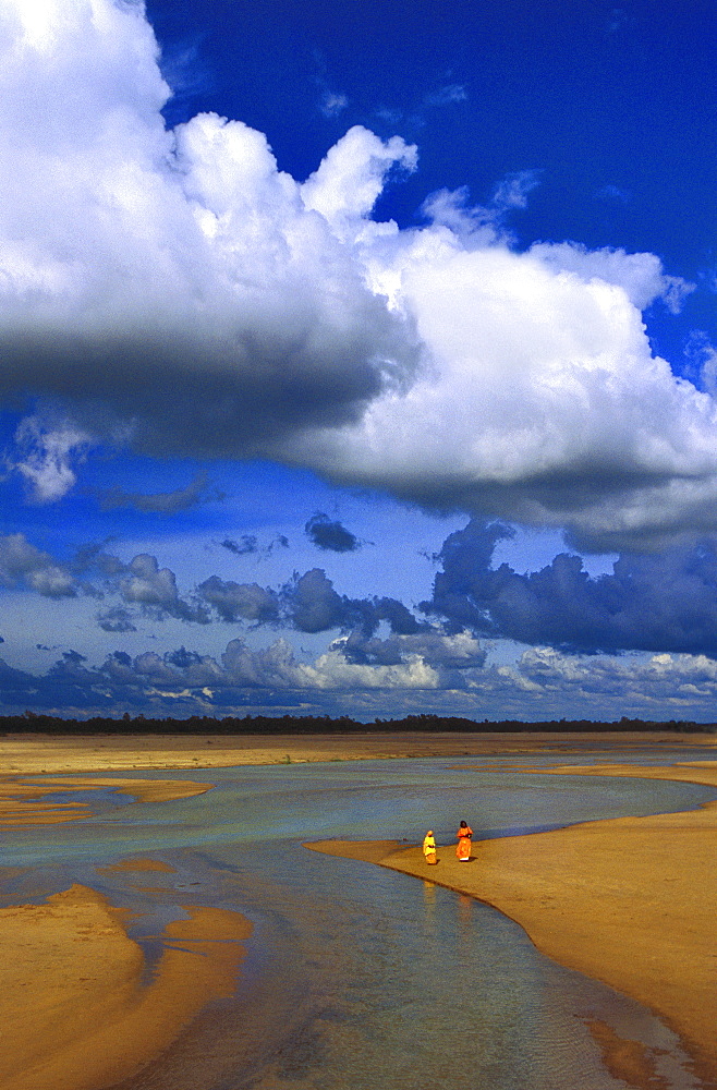 Monsoon clouds over almost dry bed of river Mayurakshi, West Bengal, India