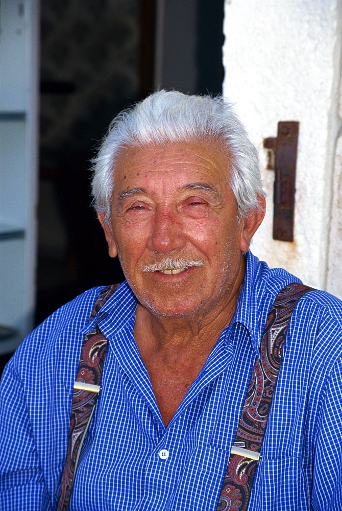 Portrait of a fisherman with a moustache, and wearing braces on Hvar Island, Croatia, Europe