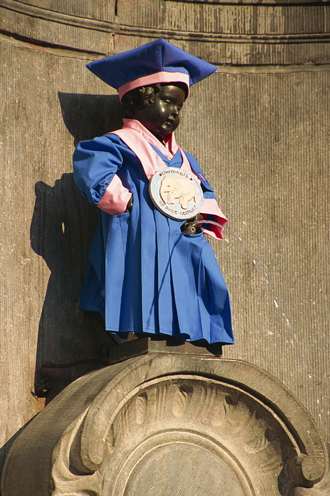 Manneken Pis statue dressed in garb of Brotherhood of Red Elephant, a brewery charity, Brussels, Belgium, Europe