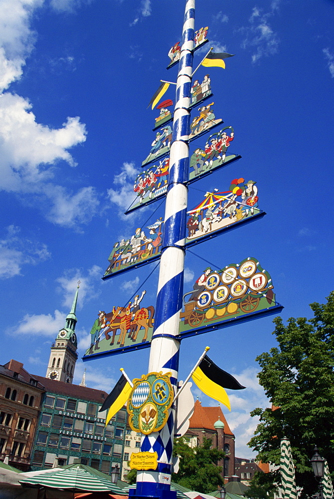 The maypole on the Viktualienmarkt in the city of Munich, Bavaria, Germany, Europe