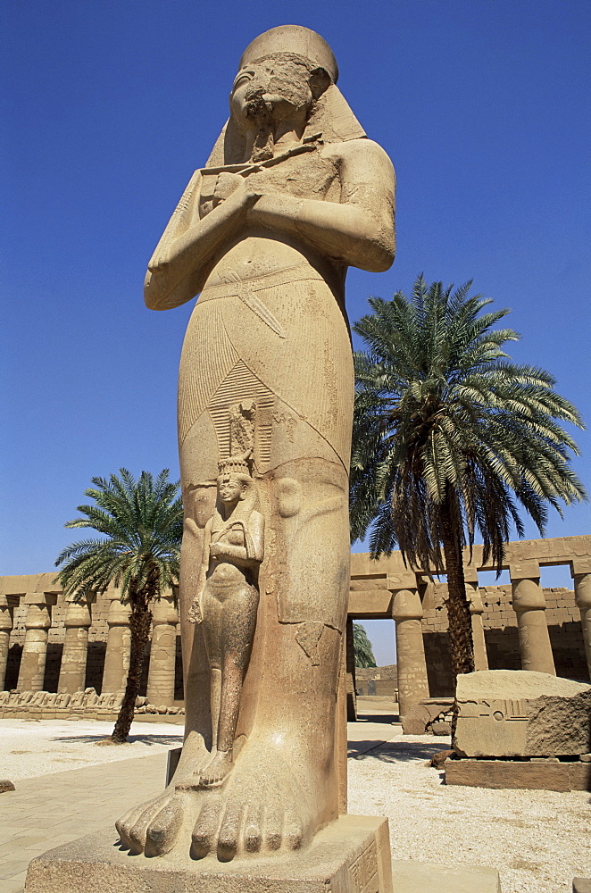 Ramses II and daughter Bant Anta, in forecourt of the temple of Karnak, UNESCO World Heritage Site, Thebes, Egypt, North Africa, Africa