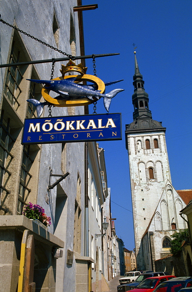 Sign for the Mookkala Restaurant with the Niguliste Church behind, Old Town, Tallinn, Estonia, Baltic States, Europe