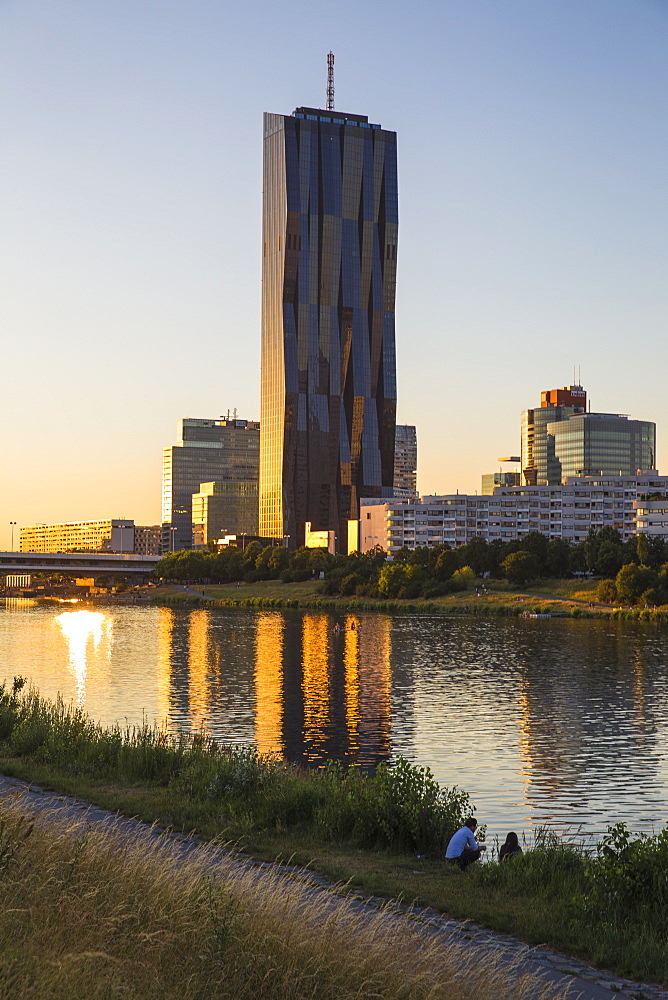 Donau City and DC building reflecting in New Danube River, Vienna, Austria, Europe