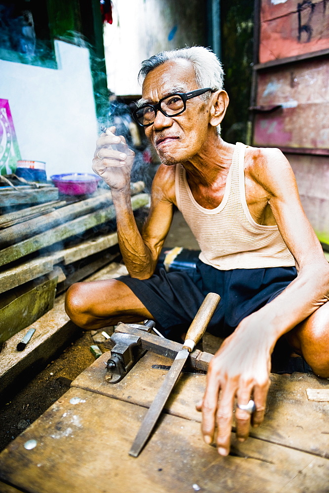 Portrait of an Indonesian carpenter man at Taman Sari, Water Castle, Yogyakarta, Central Java, Indonesia, Southeast Asia, Asia