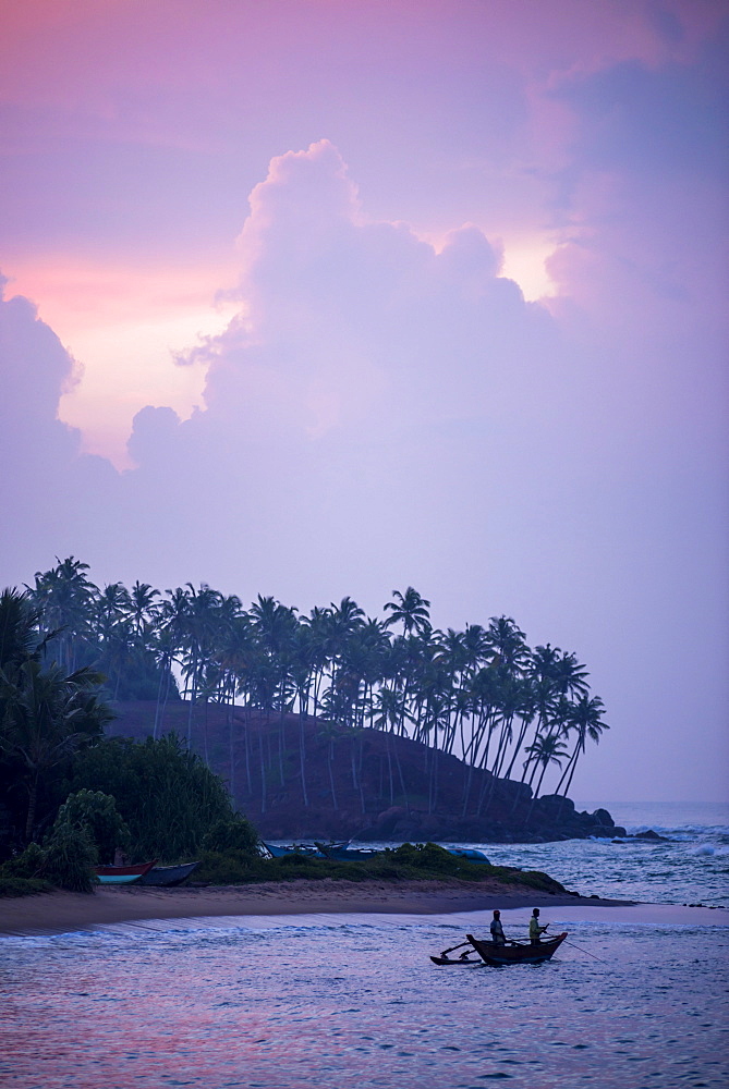 Mirissa Beach, traditional Sri Lankan outrigger fishing boat at sunrise, South Coast, Southern Province, Sri Lanka, Asia 