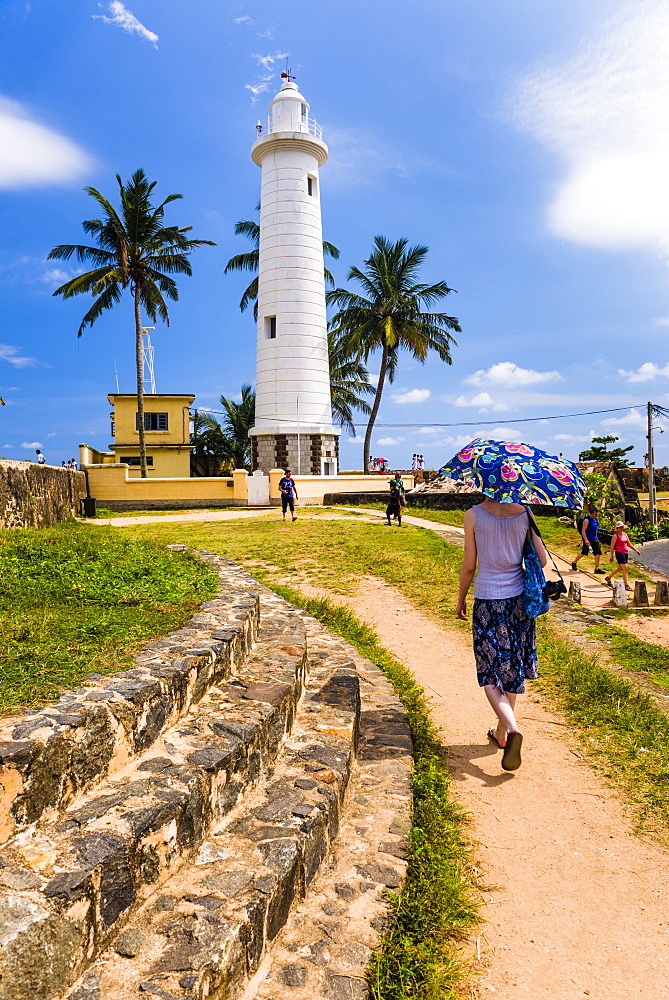 Tourist visiting Galle lighthouse in the Old Town of Galle, UNESCO World Heritage Site, Sri Lanka, Asia 