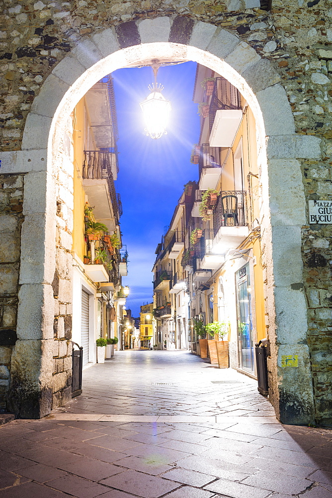 Porta Catania, one of the entrances to Corso Umberto, the main street in Taormina at night, Sicily, Italy, Europe 