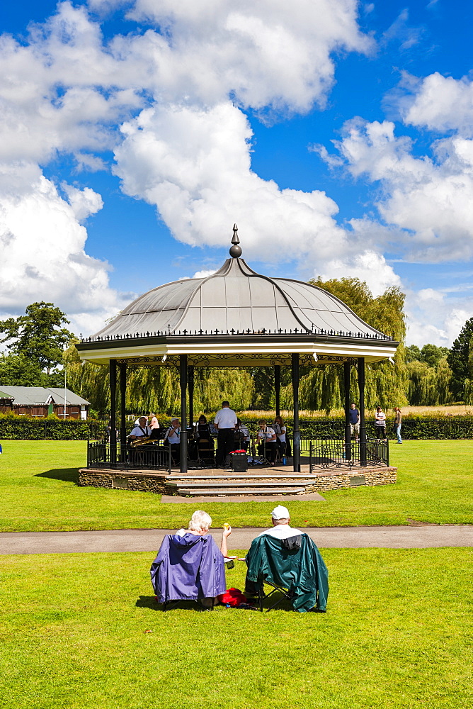 People watching a performance at the bandstand, Godalming, Surrey, England, United Kingdom, Europe 