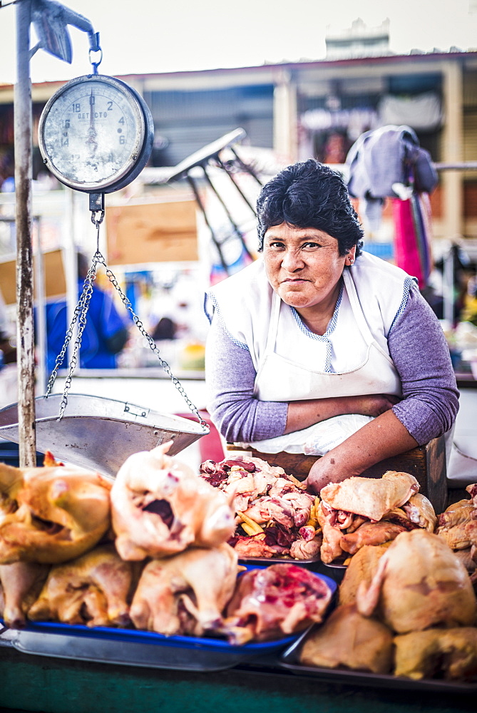 Portrait of Peruvian woman selling meat at San Camilo Market (Mercado San Camilo), Arequipa, Peru, South America