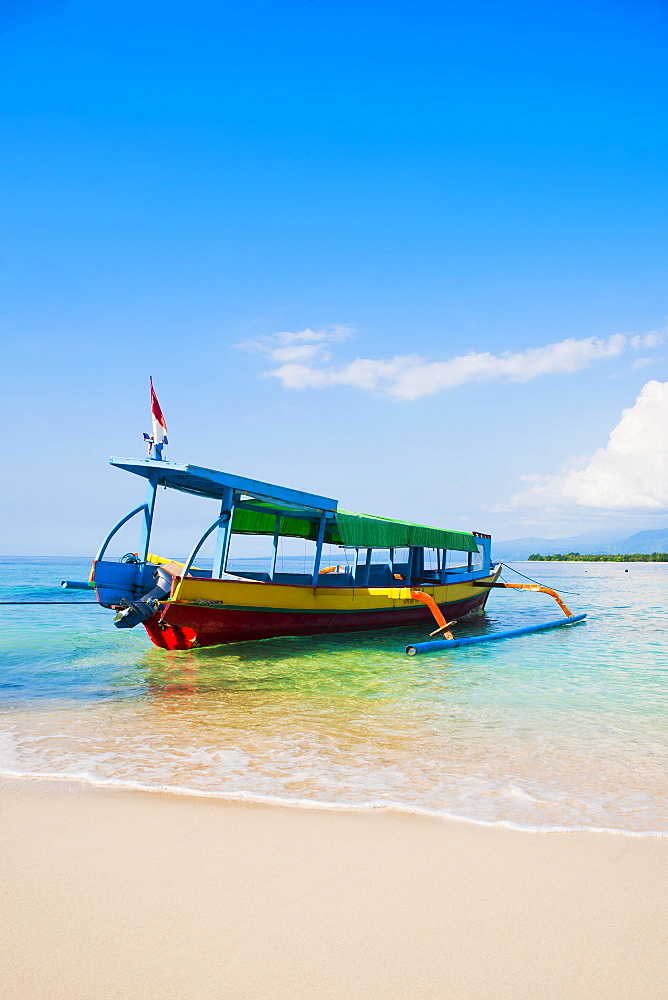 Traditional colourful Indonesian boat on the tropical island of Gili Meno, Gili Islands, Indonesia, Southeast Asia, Asia