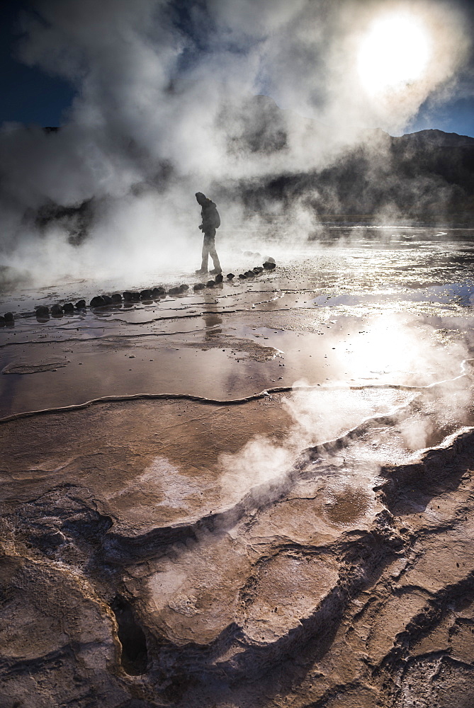 Tourist at El Tatio Geysers (Geysers del Tatio), the largest geyser field in the Southern Hemisphere, Atacama Desert, Chile, South America