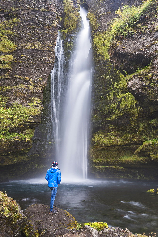 Tourist at Gluggafoss (Window Falls aka Merkjarfoss), a waterfall on the Merkja River, South Iceland (Sudurland), Iceland, Polar Regions