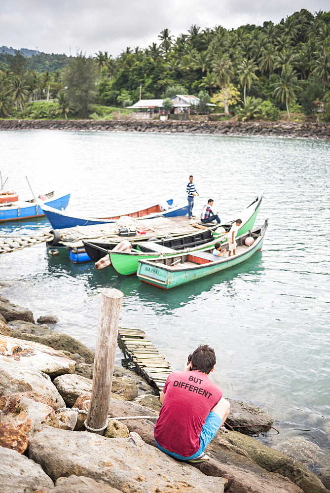 Tourist taking a photo of fishermen on Pulau Weh Island, Aceh Province, Sumatra, Indonesia, Southeast Asia, Asia