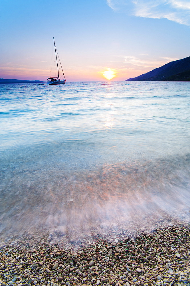 Adriatic Sea off Zlatni Rat Beach at sunset, Bol, Brac Island, Dalmatian Coast, Croatia, Europe 