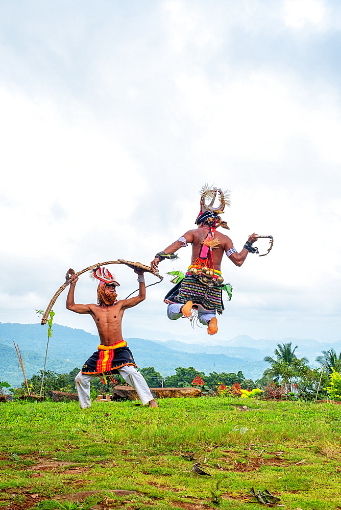 Caci men perform a traditional whip dance with bamboo shields and leather whips, western Flores, Indonesia, Southeast Asia, Asia