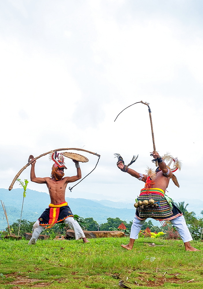 Caci men perform a traditional whip dance with bamboo shields and leather whips, western Flores, Indonesia, Southeast Asia, Asia