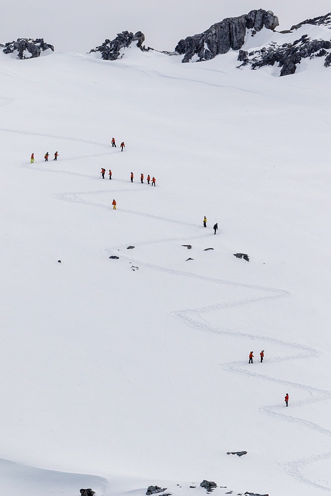 Lindblad Expeditions guests from the National Geographic Explorer hiking at Orne Harbor, Antarctica, Polar Regions