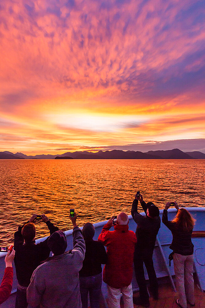 Lindblad National Geographic guests enjoying sunset at Chichagof Island, southeast Alaska, United States of America, North America