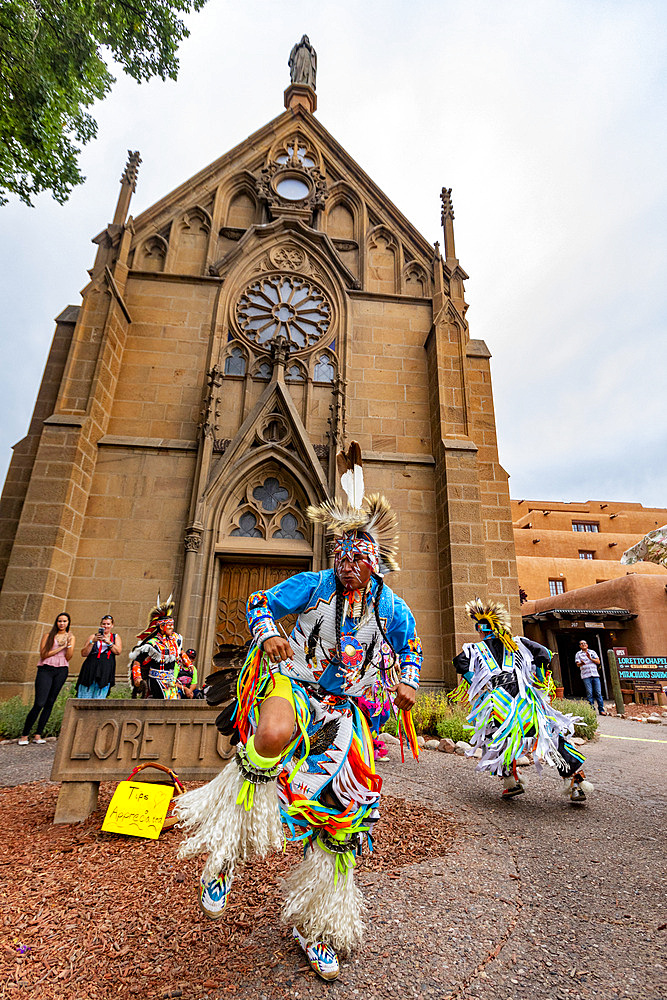 Santa Fe Indian Market participants in traditional regalia perform in downtown Santa Fe, New Mexico, United States of America, North America