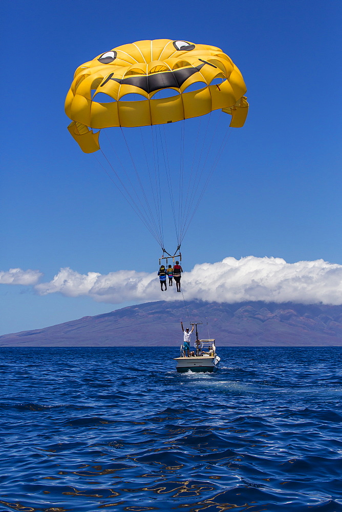 Visitors parasailing in the AuAu Channel, Maui, Hawaii, United States of America, Pacific