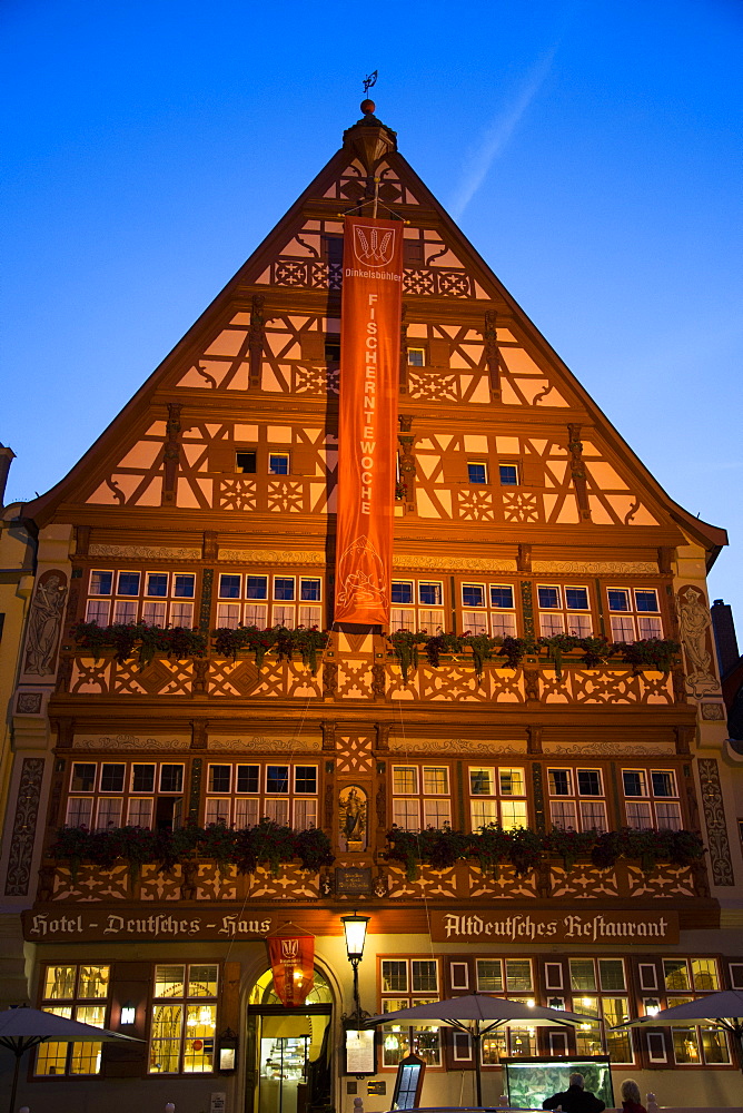 Gasthof Deutsches Haus, restaurant in the old town at dusk, Dinkelsbuehl, Franconia, Bavaria, Germany