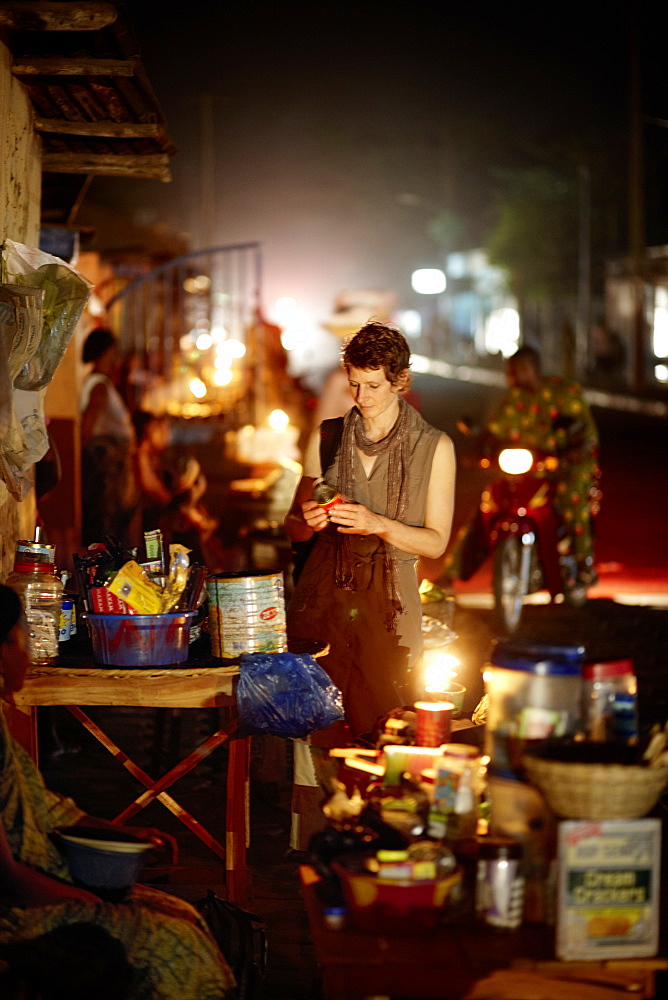 Woman at a night market, Ouidah, Atlantique Department, Benin