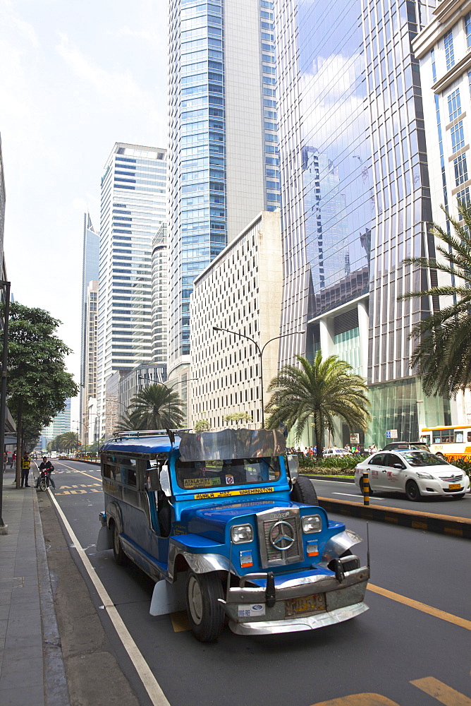 Jeepney typical phillipine public transport, Ayala Avenue in Makati City, the financial and business district in the center oft 