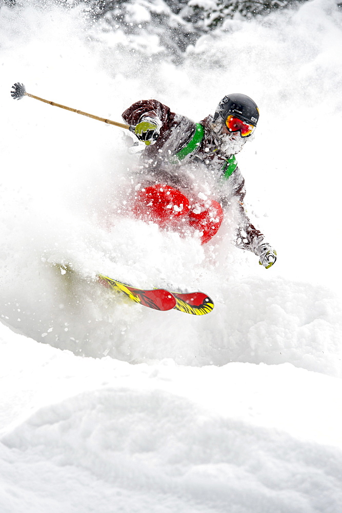 Closeup of a skier in the woods skiing in fresh powder snow, Gerlos, Zillertal, Austria