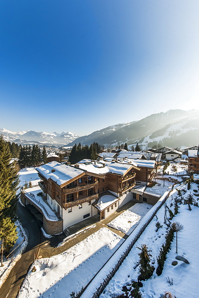 view to Kitzbuehel and Hahnenkamm from the penthouse terrace in modern Alpine look, Kitzbuehel, Tirol, Austria, Europe