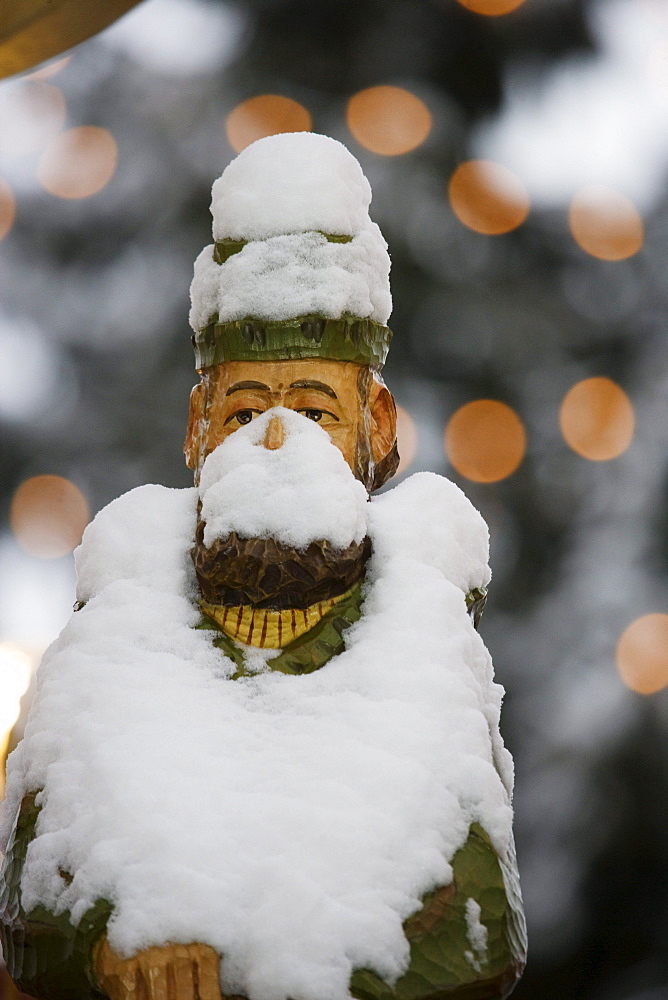 Snow-covered wooden figure, christmas market, Annaberg-Buchholz, Ore mountains, Saxony, Germany