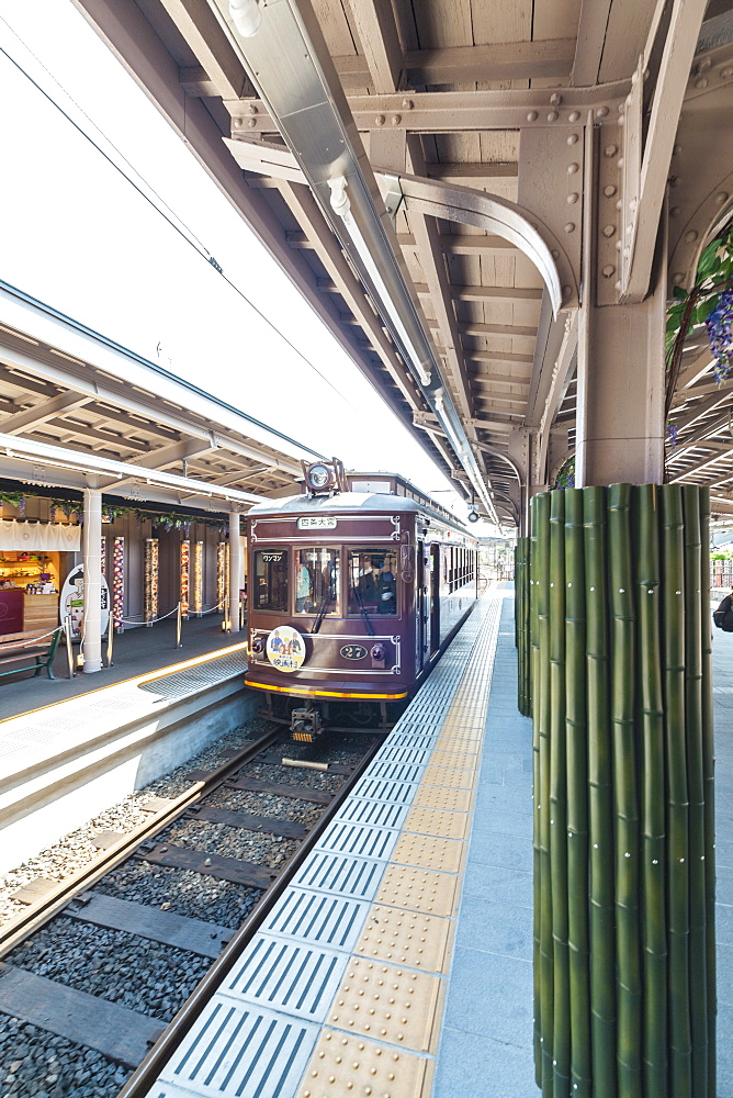 Small train Randen arriving Arashiyama, Kyoto, Japan